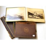Three albums and a folio of 19th century photographs, mainly albumen, including interesting Alpine