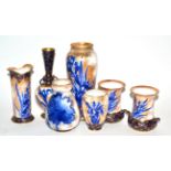 * A pair of Royal Doulton Flow Blue twin-handled ovoid vases, 12cm; a large baluster vase, 23cm