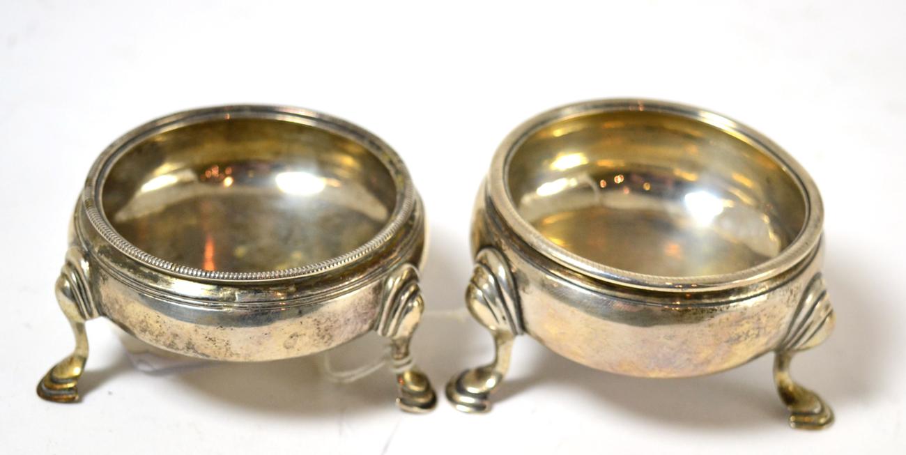 # A pair of George III silver salts raised on hoof feet, London 1782