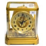 A brass atmos clock, signed Jaeger LeCoultre, retailed by Fattorini & Sons Ltd, Bradford, 20th