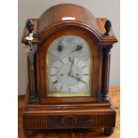 An oak striking table clock, circa 1890, arched case with acorn finials, side sound frets,