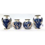 * A pair of Doulton Burslem Flow Blue ovoid vases, 13cm; a similar pair of twin-handled vases,