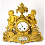 An ormolu and porcelain mounted striking mantel clock, circa 1890, floral urn flanked by two