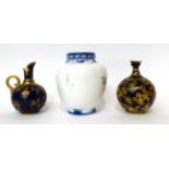 * A Royal Crown Derby blue ground ewer; a similar decorated ovoid vase; and a Royal Crown Derby vase