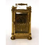 * A brass miniature carriage timepiece, 20th century, carrying handle, brass dial with Roman