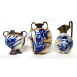 * A Doulton Burslem Flow Blue twin-handled ovoid vase, 18.5cm; a similar vase, 14.5cm; and a ewer,