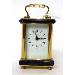 * A brass and lapis lazuli mounted carriage timepiece, retailed by Asprey, 20th century, carrying