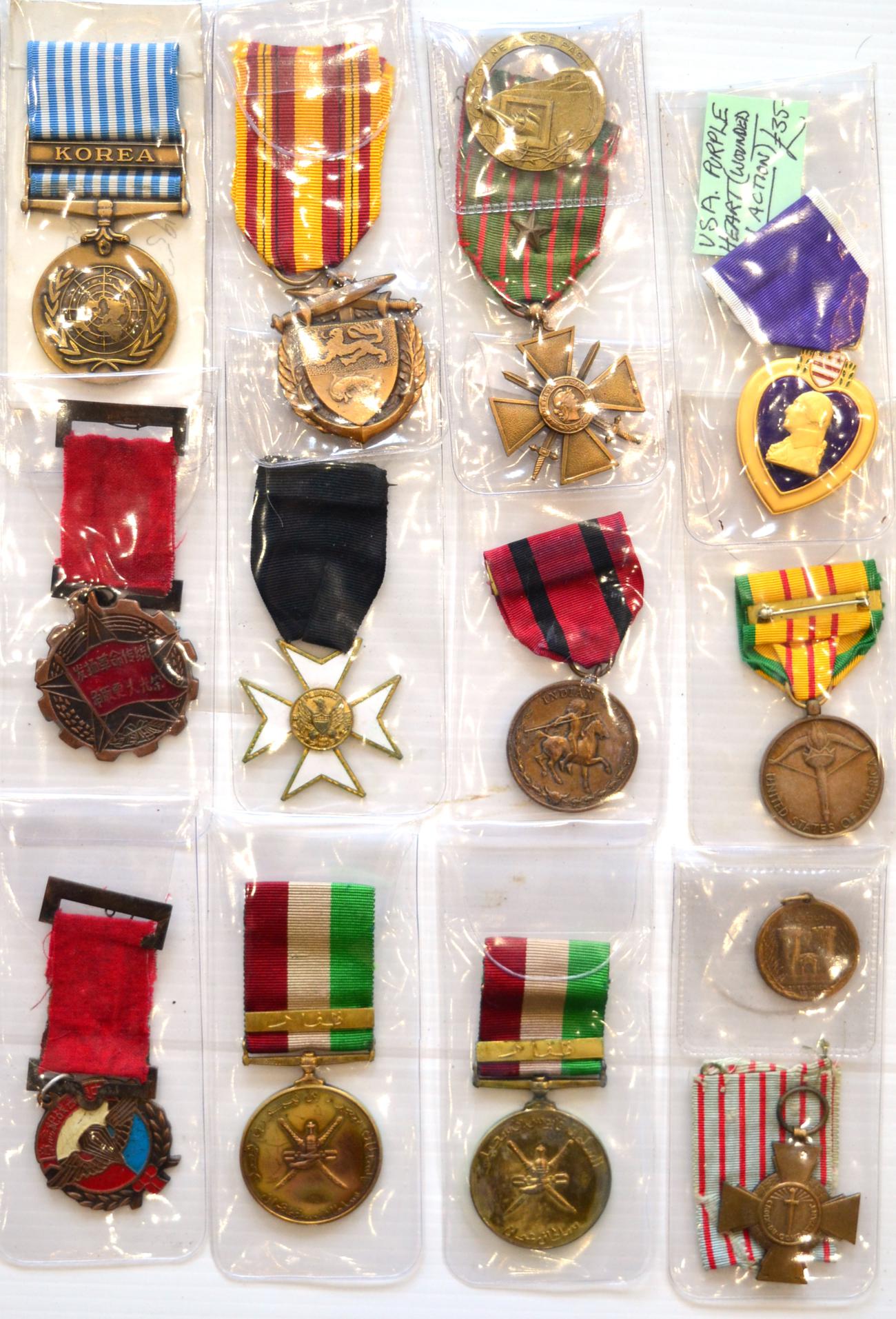 A Collection of Fourteen Medals, including US Purple Heart, UN Korea Medal, French Croix de Guerre