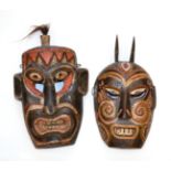 Two South China Polychrome Wood Masks, each with pierced eyes, aquiline nose and grimacing teeth,