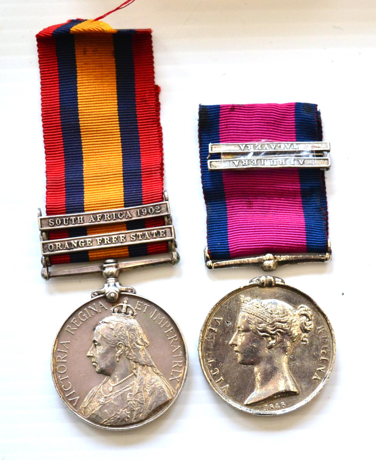 A Queen's South Africa Medal, 1899, with two clasps ORANGE FREE STATE and SOUTH AFRICA 1902, awarded