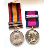 A Queen's South Africa Medal, 1899, with two clasps ORANGE FREE STATE and SOUTH AFRICA 1902, awarded