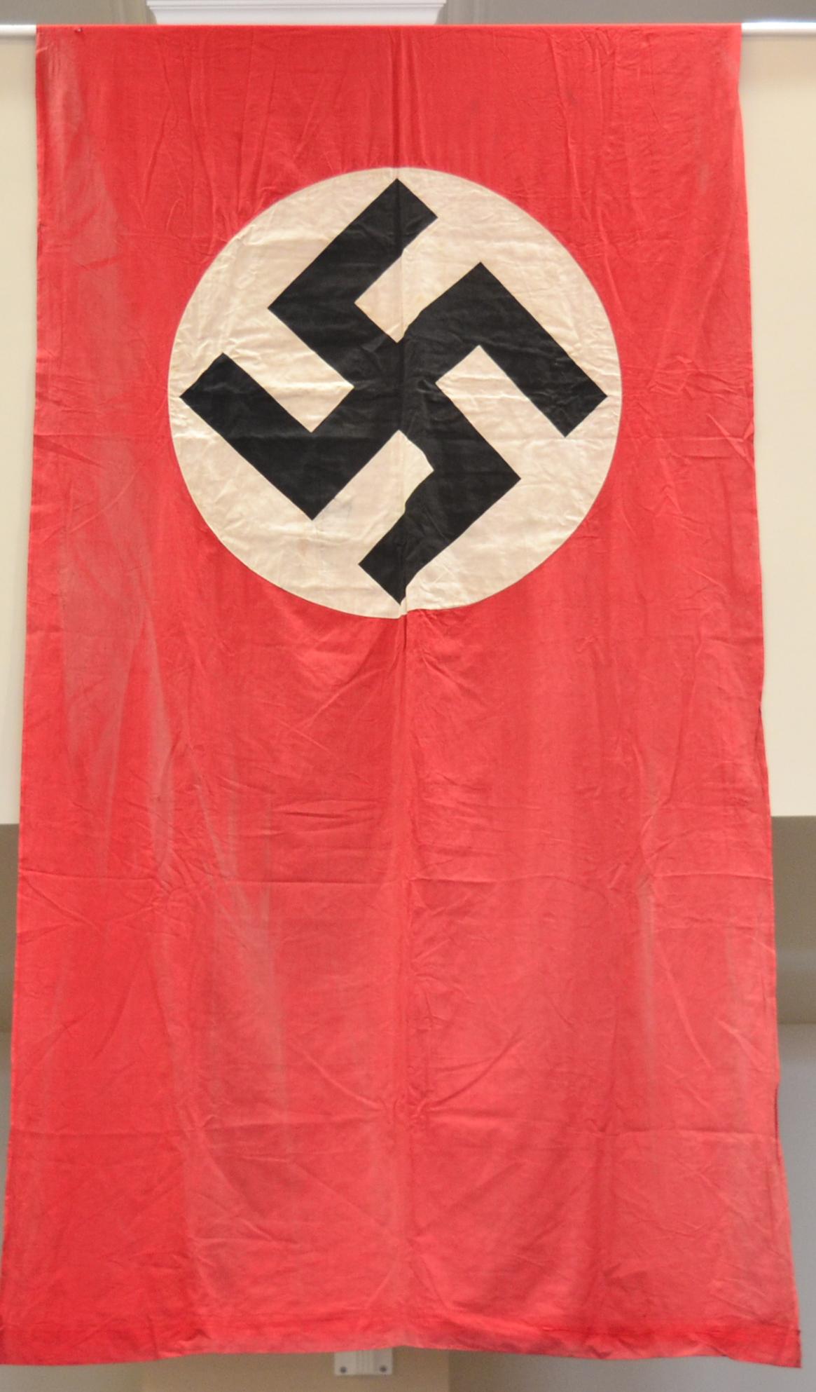 A German Third Reich NSDAP Standard Hanging Banner, with hemmed ends, each side of the scarlet
