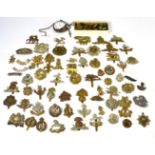 A Collection of Approximately Seventy Military Cap and Other Badges, including shoulder titles,