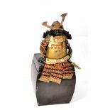 An Early 20th Century Lacquered and Brass-Mounted Miniature Suit of O-Yoroi Japanese Samurai Armour,