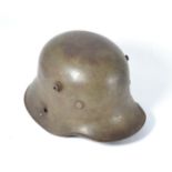 A German M16 Transitional Army Helmet, the left side with the remains of a single decal, the left