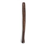 An Australian Aborigine Dark Hardwood Pole Club, carved with sinuous snakes on a finely chip