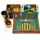 A Collection of Thirty Brass Shell Cases and Deactivated Bullets,in an oak-framed and glazed display