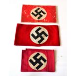 A German Third Reich NSDAP Member's Armband, of three piece construction in red wool applied with