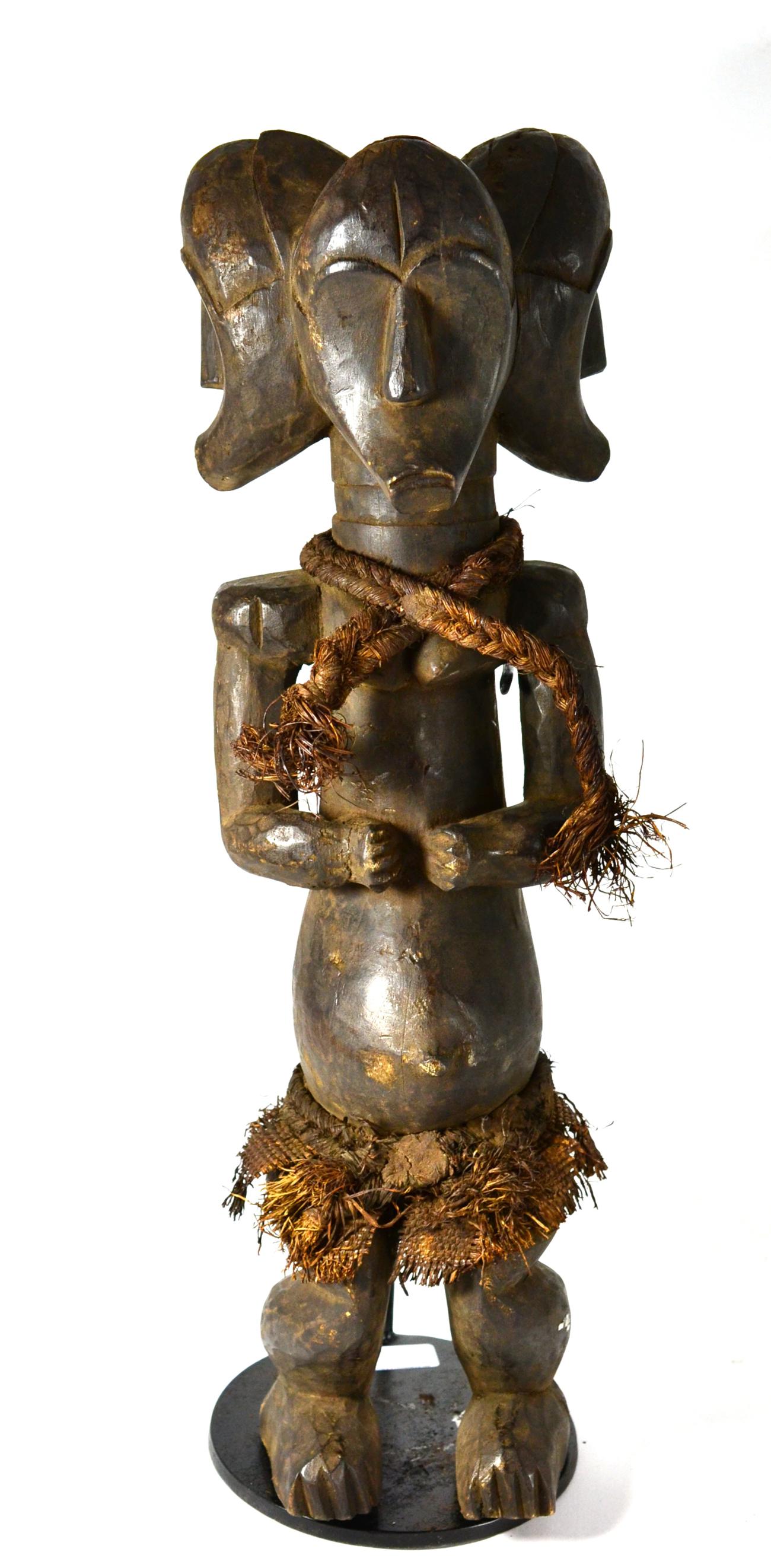 A Fang Triple Headed Maternity Figure, standing on half bent legs, her hands clasped above her