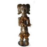 A Fang Triple Headed Maternity Figure, standing on half bent legs, her hands clasped above her