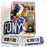 A Quantity of American Cloth Insignia, badges, shoulder boards, belt buckles etc, in two boxes
