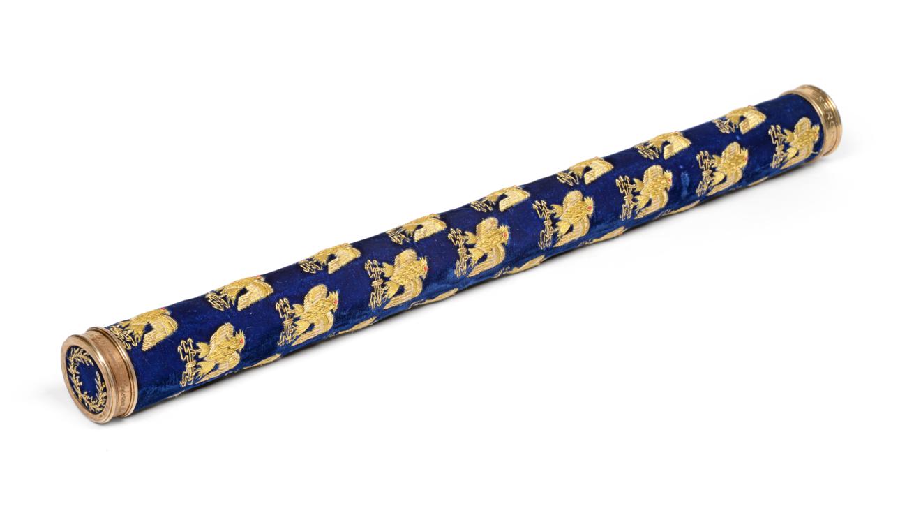 A Silver Mounted Ceremonial Baton, with gold thread embroidered eagles on a blue ground, the