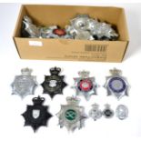 A Quantity of White Metal and Enamel Police Helmet Plates, and badges, mainly to the West