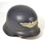 A German Third Reich Luftschutz M40 Helmet, with dark blue paint and silver decal, the back inner