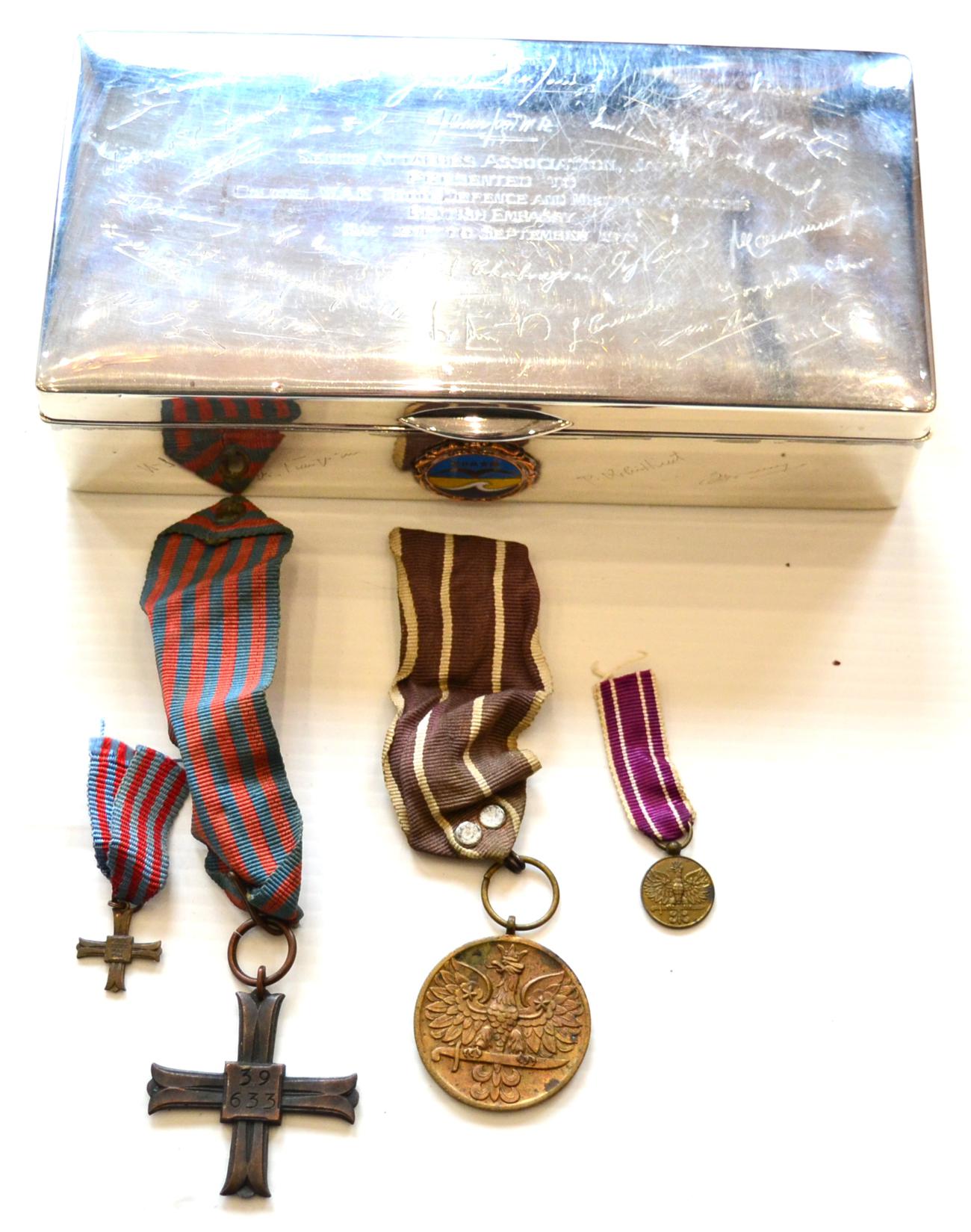 A Polish Active Service Medal and a Monte Cassino Cross, the reverse of the latter officially