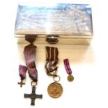 A Polish Active Service Medal and a Monte Cassino Cross, the reverse of the latter officially