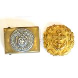 A German Third Reich SA EM/NCO's Belt Buckle, of brass and white metal two piece construction, 4.8cm