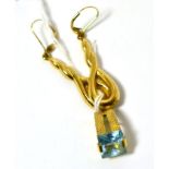 A gold and gem set pendant, stamped 750 and a pair of 9ct gold earrings