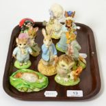 Nine Beatrix Potter figures including Beswick, Royal Albert and Royal Doulton Light crazing to