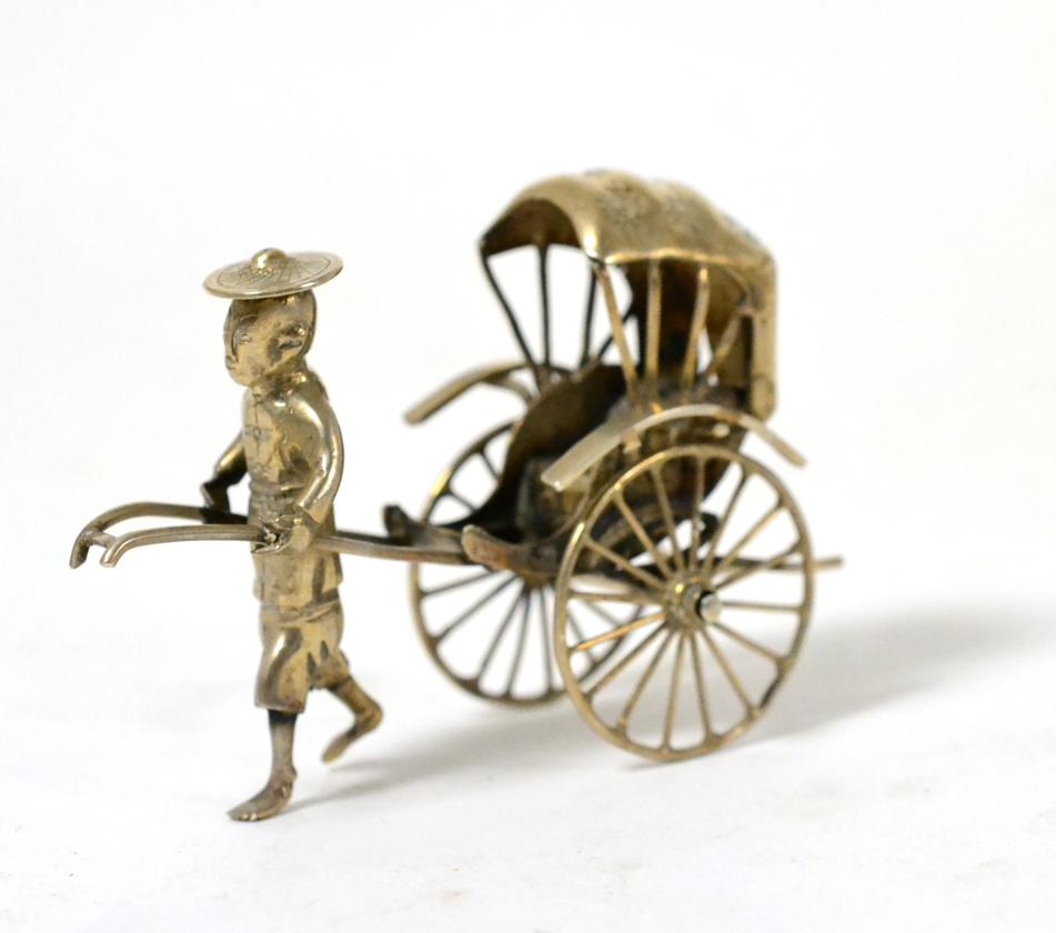 A Chinese silver model of a rickshaw and driver