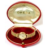 A lady's Omega 9ct wristwatch, associated bracelet, cased