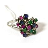 A sapphire, diamond, ruby and emerald spray cluster ring