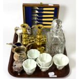 A group of five Shelley porcelain jelly moulds, cut glass decanter, silver plated flatware, brass