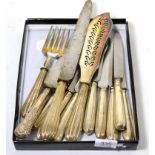 Eight silver handled knives, bread knife, fish slice and two forks