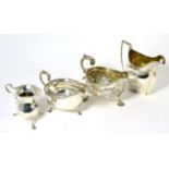 Two silver sauce boats and two silver cream jugs