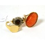 A garnet and diamond cluster ring, a carved cornelian (?) ring and a 9ct gold signet ring (3)