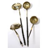 A group of four horn handled silver toddy ladles