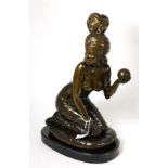 A 20th century bronze of a fortune teller holding a crystal ball, plinth base