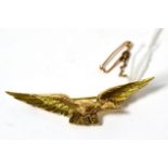 A gold RAF eagle pin, stamped 15ct