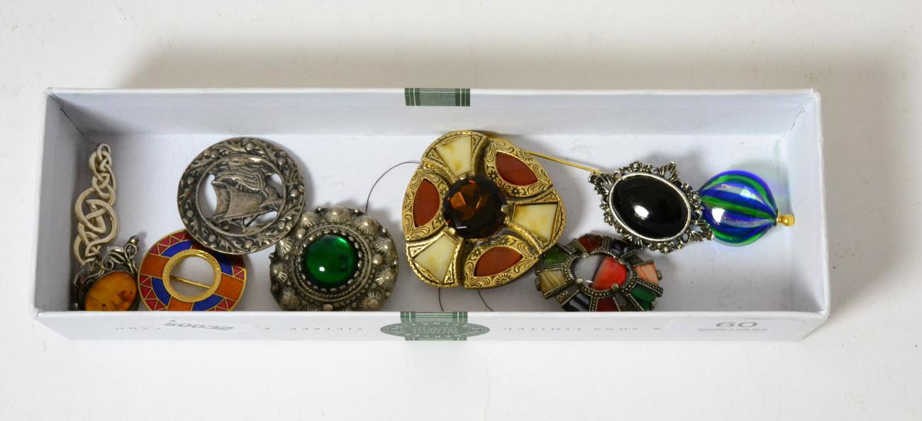 A group of Scottish and other brooches including Miracle silver etc