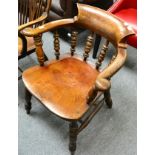 A 19th century elm captain's chair