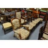 A set of five mahogany dining chairs with Liberty style upholstered seats, together with two elbow