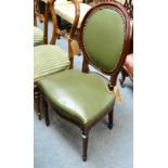 A green leather side chair