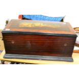 A marquetry inlaid part ebonised rosewood music box, with original paper tune list