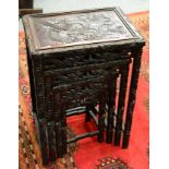 A nest of Chinese quartetto tables carved with dragons