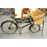 A vintage Raleigh delivery bicycle with leather saddle, Sturmey Archer three speed hub gear and a